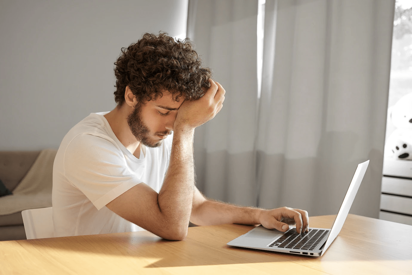 frustrated man with a laptop