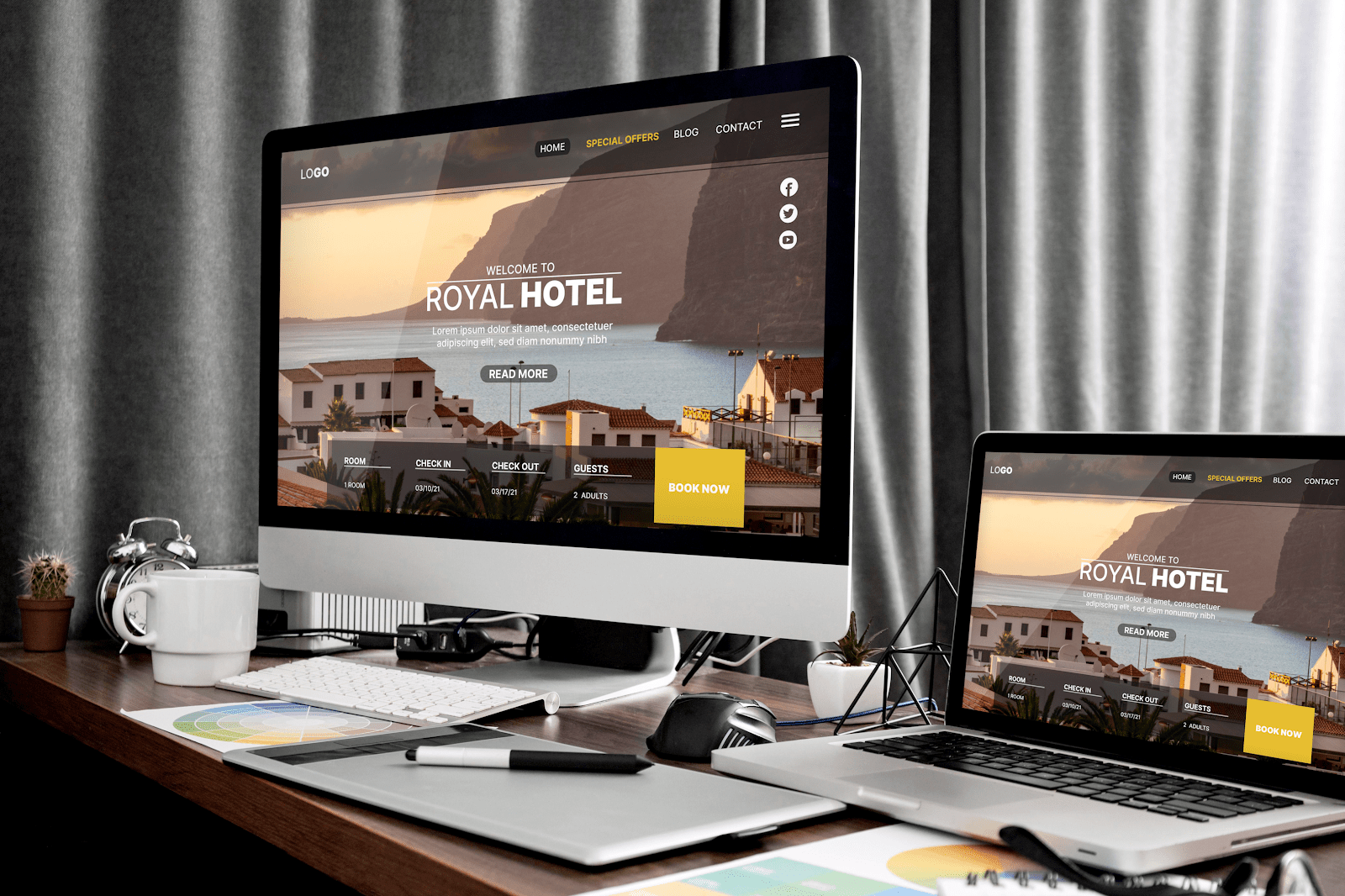 landing page of a hotel opened on a pc screen and a laptop