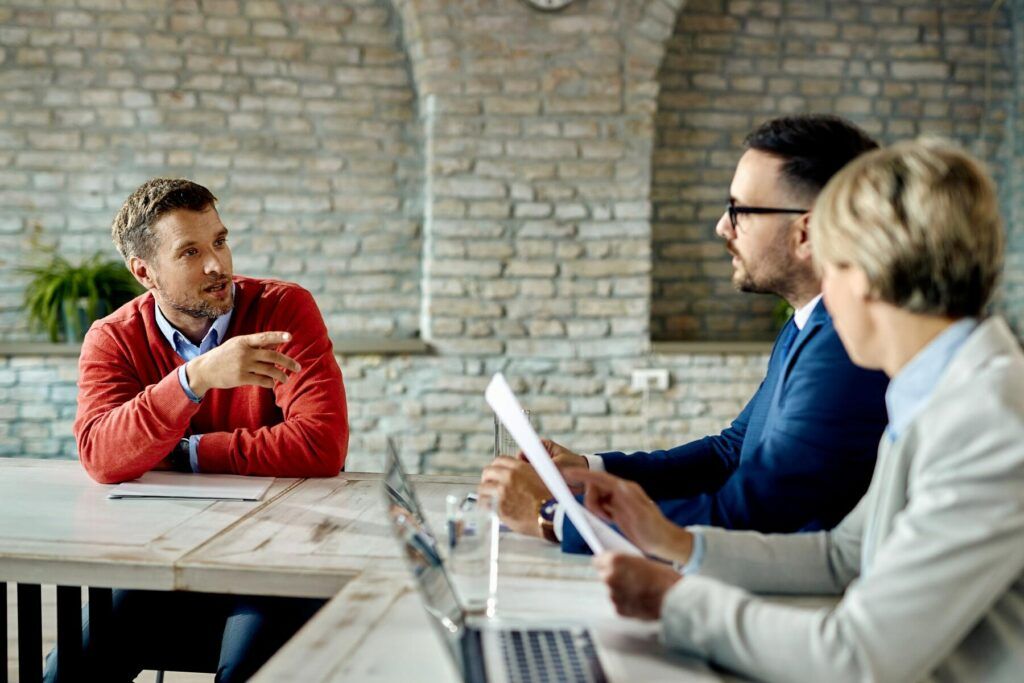 three people having a user research interview 