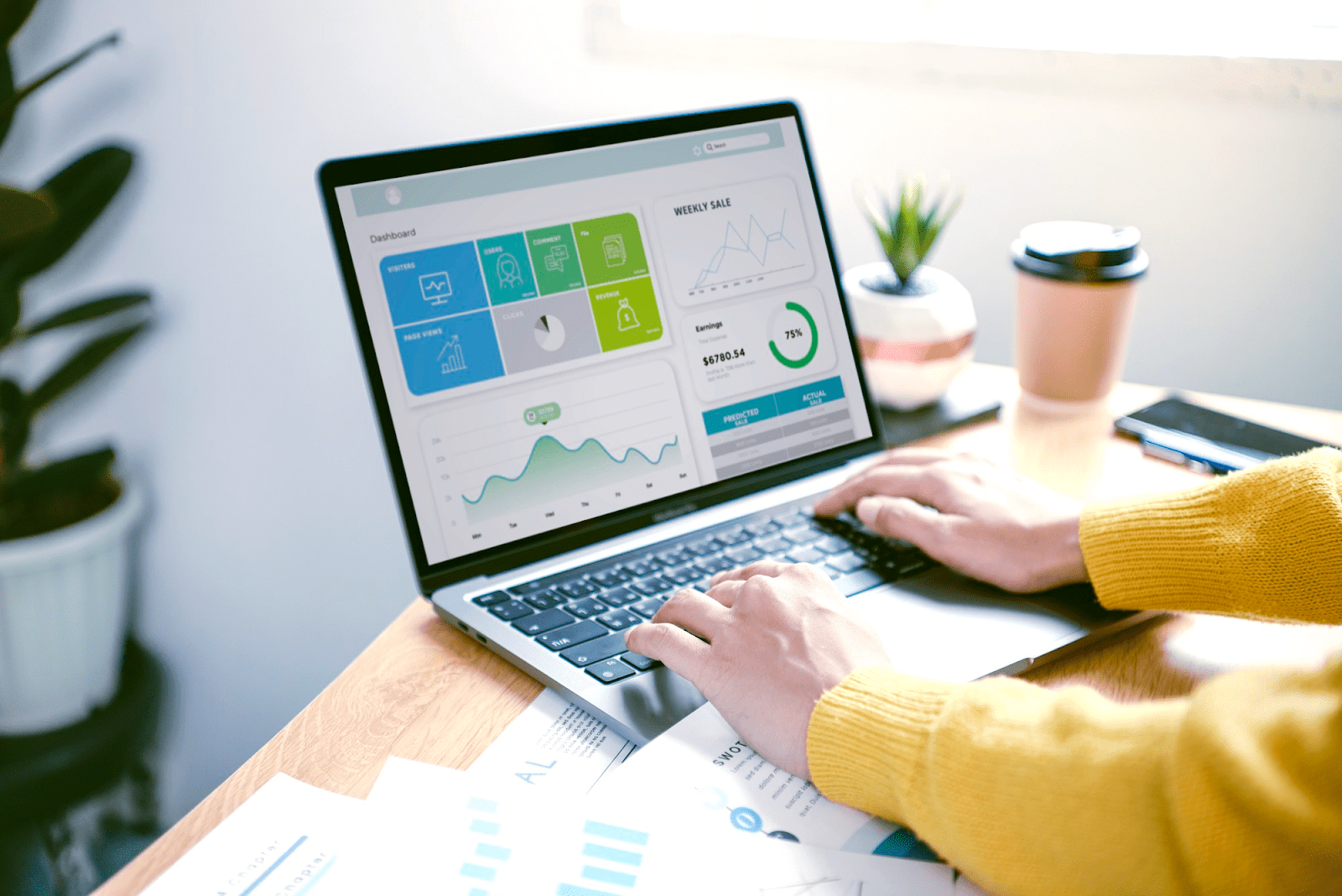 person looking at customer analytics on a laptop