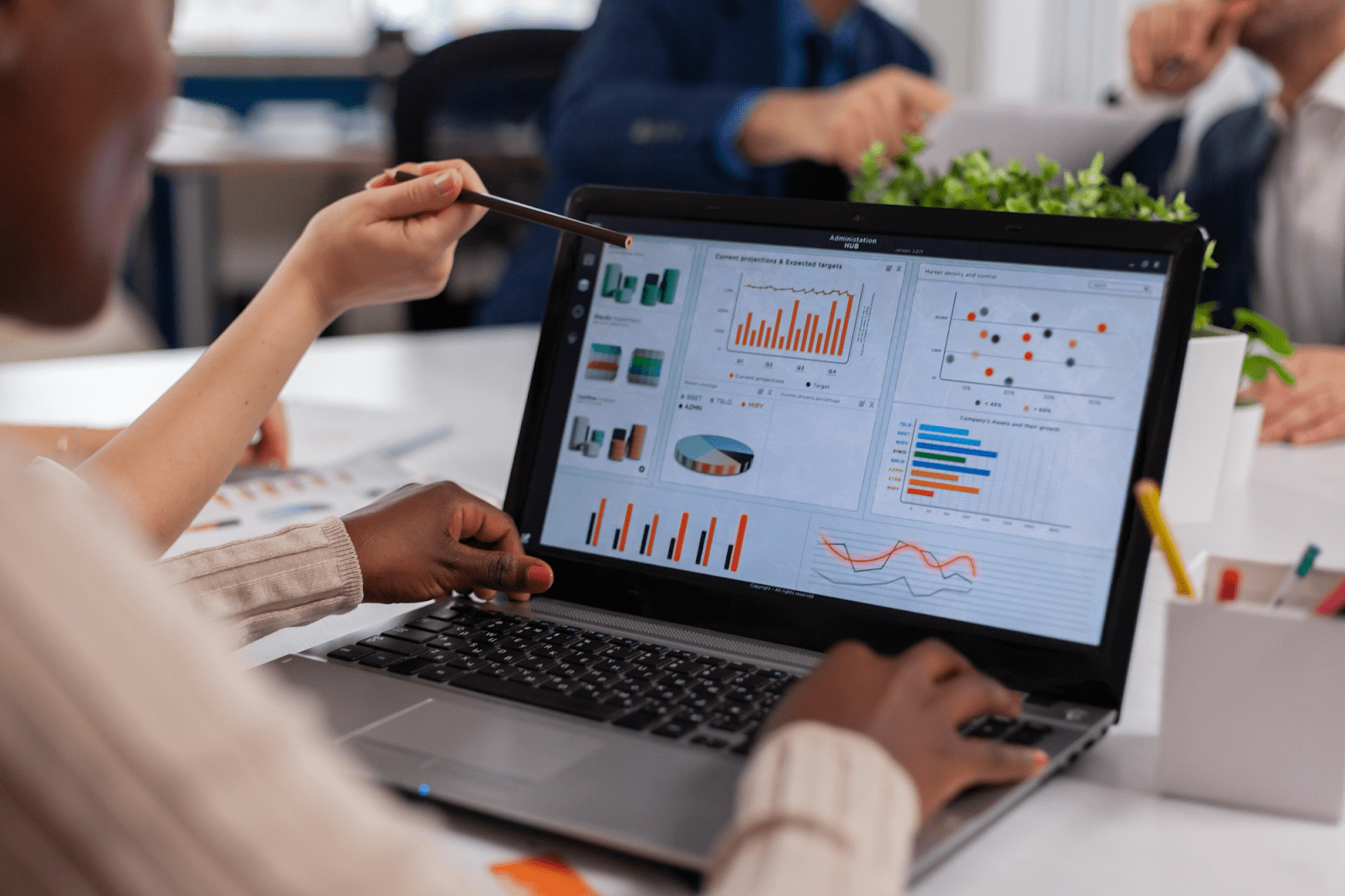 woman looking at analytics on a laptop