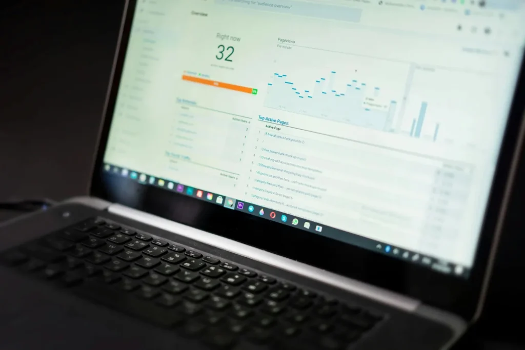 Laptop displaying ecommerce analytics and website traffic performance dashboard.