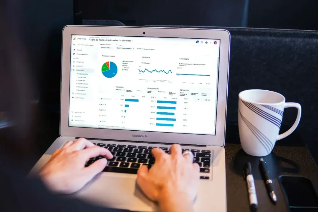 Laptop displaying ecommerce analytics dashboard illustrating key reasons visitors bounce from ecommerce websites and how analytics can identify user behavior issues.